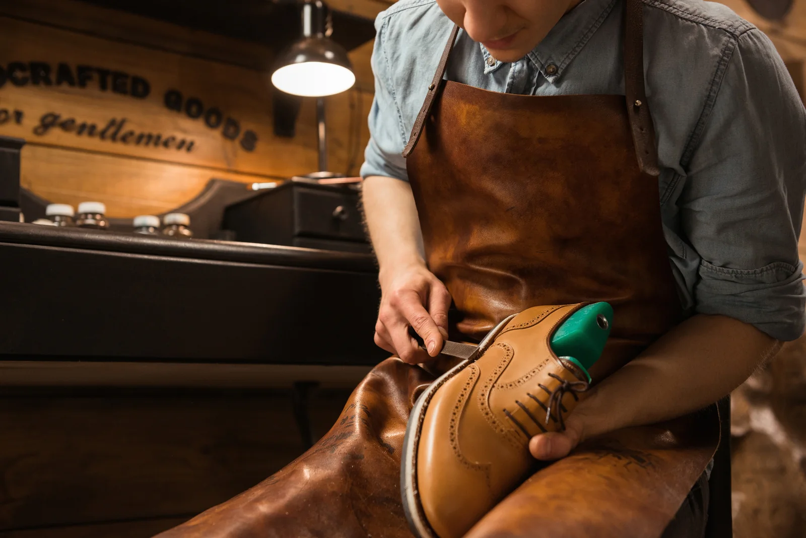 Craftsperson working on leather footwear