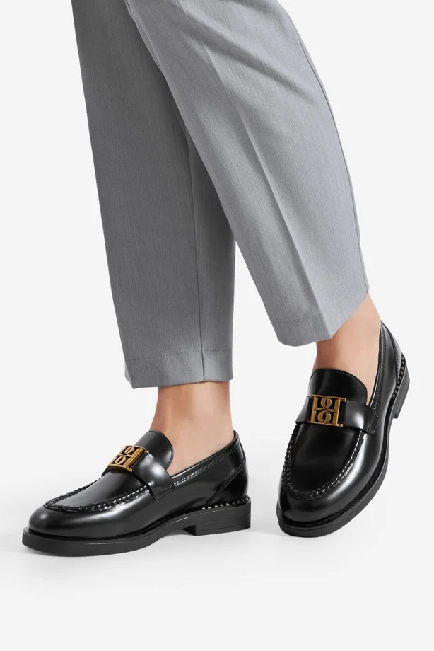 Side profile of black loafers